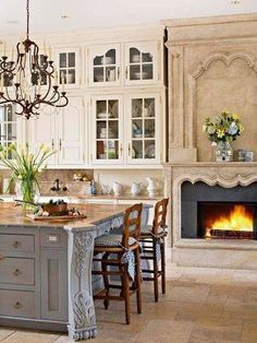 an image of a kitchen with white cabinets and gray counter tops in the color scheme