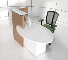 an office cubicle with a desk, chair and computer monitor on the table in front of it