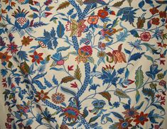 the fabric is very colorful and has many flowers on it