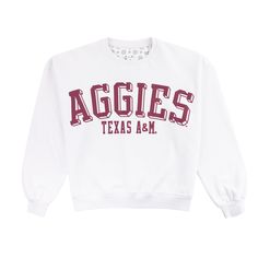 Support your favorite team in style with our Texas A&M Aggies Semi-Pro Janise Crewneck sweatshirt. This white sweatshirt features bold, maroon lettering that proudly states "Aggies Texas A&M". Stay cozy and show your team spirit with this comfortable and stylish sweatshirt! Brand: Pressbox 65% Cotton/35% Polyester Machine Wash Cold/Tumble Dry Low Relaxed Fit Tops With Logo Lettering For Fall, Fall Tops With Logo In Relaxed Fit, White Cotton Sweatshirt With Logo Lettering, White Sporty Sweatshirt With Logo Lettering, White Sweatshirt With Logo Lettering For Streetwear, White Logo Sweatshirt For Streetwear, Sporty White Sweatshirt With Logo Lettering, Varsity Sweatshirt With University Logo For Game Day, Collegiate Sweatshirt With University Logo For Game Day