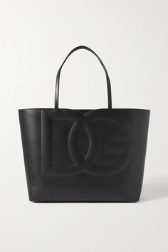 Dolce & Gabbana's tote is embossed with a large-scale 'D&G' moniker that's forever iconic. It's been crafted in Italy from structured leather and is roomy enough to carry so much more than your purse, phone and makeup, so it's perfect for shopping days or work. Dolce And Gabbana Bag, Tote Outfit, Nye Outfits, Big Bags, Shopping Day, Bago, Womens Tote Bags, Embossed Leather, Women Collection