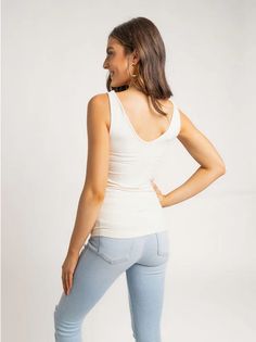 Meet our our new tank top obsession. This Seamless Tank features a v-neckline and a scoop neckline, so you can style it 2 ways. Style it with the v-neck in front and the scoop neck on back, or the other way around! The material makes this top buttery soft and super stretchy. - Can be worn with a v-neck or scoop neck - Stretchy Material 92% nylon 8% spandex Hand wash cold, lay flat to dry. New Tank, On Back, Sales Gifts, Stretchy Material, Scoop Neckline, Basic Tank Top, Scoop Neck, White And Black, Black And Grey