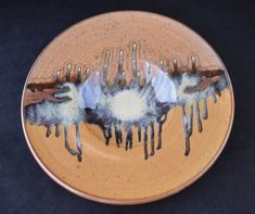 a plate that has some kind of thing on it with icing and chocolate drizzled all over it