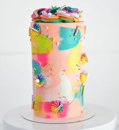 there is a colorful cake with unicorns on it