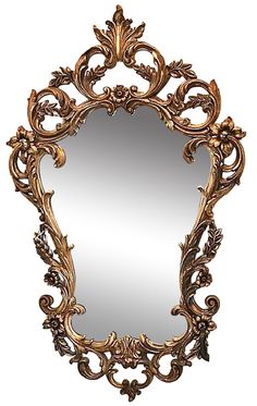 an ornate gold framed mirror on a white background