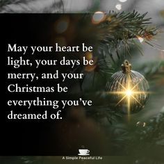 a christmas ornament hanging from a tree with the words, may your heart be light, your days be merry, and your christmas be everything you've