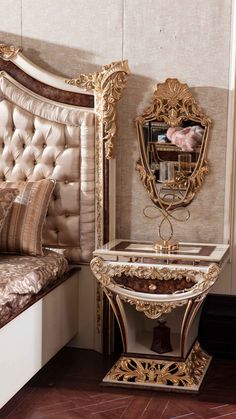 an ornately decorated bed and mirror in a room