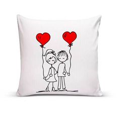 a pillow with a drawing of two people holding red heart shaped balloons on it's back