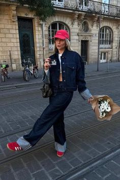 Explore 8 double denim outfit ideas for a chic, casual look that's effortlessly cool. This total denim look with red Adidas Gazelle sneakers and a red cap is just one way to wear the trend! Red Shoes Jeans Outfit, Style With Adidas Samba, Red Addidas Shoes Outfits Girl, Outfits With Red Adidas Shoes, Red Gazelles Adidas Outfit, Red Sneaker Outfits Women, Gazelle Red Adidas Outfit, Adidas Gazelle Bold Red Outfit, Orange Adidas Gazelle Outfit