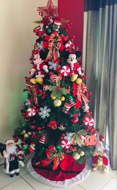 a christmas tree with mickey mouse decorations