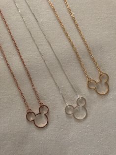 Trendy and stylish Mickey pendant, Great price and made with quality material. Get you one or someone you love, its the perfect gift. Please contact shop if you have any questions or would like an quote for wholesale or bulk. Packaging: * Necklace will already be in beautiful  small gift box. Pendant: *Silver, Gold Plated & Rose Gold * 1 inch x 3/4 in (25mm x18mm) Chain: *1mm in width 20inches in lenght with extention Disney Gold Necklaces For Gifts, Minnie Mouse Necklace, Disney Silver Charms Jewelry, Disney Gold Mickey Mouse Jewelry, Silver Disney Mickey Mouse Jewelry, Small Gift Boxes, Rose Gold Plates, Silver Gold, Or Rose