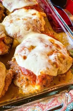 chicken parmesan casserole with melted cheese and sauce in a glass dish