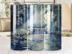 three metal canisters sitting on top of a table