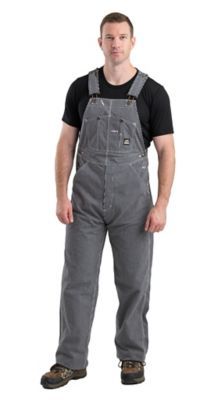 The Berne Men's Hickory Stripe Unlined Bib Overalls can be worn on their own or over pants to protect them from dirt and grease. Generously sized to be extra comfortable, these men's overalls feature reinforced back pockets, brass buckles and a handy tool pocket. Complete with a tough brass fly zipper, and triple needle stitched seams, Berne's men's overalls are made to last. Add 4 in. to 6 in. over your actual waist size for proper fit Fabric: Heavy-duty 10 oz. cotton duck for durability and mobility Triple-needle stitching on main seams adds durability Generously sized for maximum comfort Bib pocket with snap closures Double tool pocket and hammer loop Reinforced back pockets on men's overalls Brass fly zipper and heavy-duty brass buckles are built to last Add 4 in. to 6 in. over your ac Coveralls Mens, American Made Clothing, Work Overalls, Men's Overalls, Overalls Men, Mens Overalls, Mens Sleeve, Tractor Supply, Bib Overalls