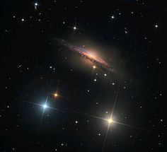 an image of a spiral galaxy in the night sky with stars around it and bright colors