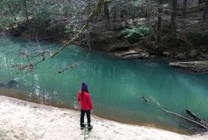 a person standing in front of a body of water