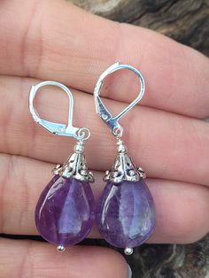 These natural purple amethyst teardrop shape are perfect for especial occasion or everyday wear. Length ( with lever back ) is around 1 1/2 inches.  The earrings with sterling silver lever back. The earring artive in gift box with beautiful rubbon for easy gift giving. Thank you for looking! Purple Amethyst Teardrop Earrings, Purple Amethyst Drop Teardrop Earrings, Purple Gemstone Teardrop Earrings, Purple Dangle Teardrop Earrings Gift, Purple Gemstone Teardrop Dangle Earrings, Nickel Free Purple Teardrop Crystal Earrings, Purple Nickel-free Teardrop Dangle Earrings, Nickel-free Purple Teardrop Crystal Earrings, Purple Teardrop Gemstone Earrings