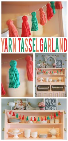 yarn tassel garlands are hanging from the ceiling and in front of a shelf