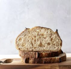 a piece of bread sitting on top of a cutting board