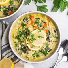 two bowls of soup with lemons and parsley