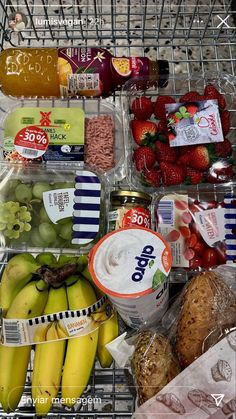 a shopping cart filled with lots of different types of food and drinks on top of it