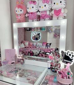 a vanity with hello kitty stuffed animals on it