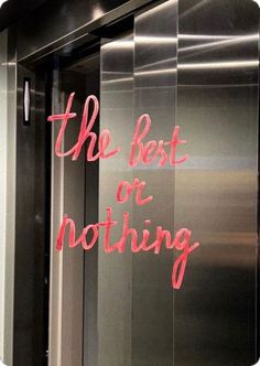 the best or nothing sign is displayed in front of an elevator door that says, the best or nothing