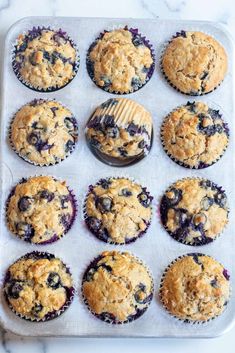 blueberry muffins are ready to be baked in the oven and served on a baking sheet