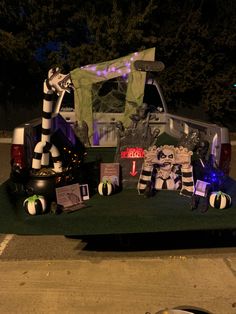 a truck with decorations on the back parked in a parking lot