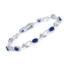 PRICES MAY VARY. Exquisite Greek Vine Design: Elevate your wrist with the exquisite beauty of this tennis bracelet featuring a Greek vine design. Crafted in high-quality 925 sterling silver, the intricate detailing adds a touch of sophistication to the piece. Vibrant Created Sapphire Brilliance: Adorn yourself with the stunning brilliance of created sapphires. The oval 6x4mm gemstones, with a total carat weight of 9.13 Cttw, showcase a deep blue hue, adding a pop of color and elegance to any out Diamonds Jewelry, Fine Jewelry Bracelets, Tennis Bracelet Diamond, Gem Stone, Bracelet For Women, Sapphire Gemstone, Bracelets And Charms, Sparkle Diamonds, Oval Diamond