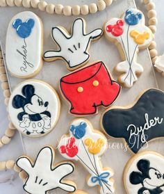 decorated cookies with mickey mouse and other disney characters