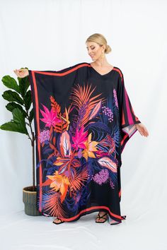 A full length kaftan plus size featured with abstract floral vibrant print  will bring the elegant vibe of forever spring and would be a perfection for holiday occasions or any event you attend. The fabric is blended silk with more than 80% silk so the care is more easier with washing and iron, in addition less wrinkles. It's totally smoothly flowy, soft and gentle touch. FEATURES - Pink, Black and Vibrant Colors - Palm and Leaf - Personal Custom Made - Full Length Kaftan Half-Sleeves - Designer Silk Kaftan - Plus Size and Custom Length - Resort Wear, Beach Wear, Lounge Wear, Pool Cover Up Kaftan - Boat Neck -------------------------------- DETAIL  * The size can be adjusted to fit up to 5 XL. Bust/ Waist/ Hip up to 53 inches ( 106 inches full circumference)  * Length of the kaftan could b Long Floral Print Patterned Kaftan, Long Patterned Kaftan With Floral Print, Long Floral Patterned Kaftan, Beach Maxi Dress With Digital Print, Floral Print Patterned Kaftan With Kimono Sleeves, Patterned Kaftan With Floral Print And Kimono Sleeves, Black Floral Print Kaftan For The Beach, Multicolor Printed Maxi Length Kaftan, Maxi Length Digital Print Kaftan For Vacation