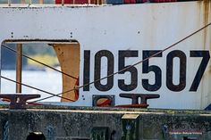 the back end of a boat with writing on it