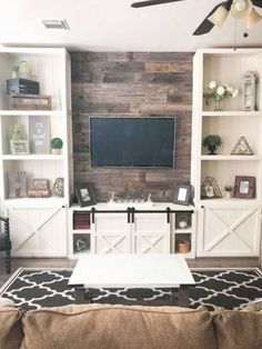 the living room is clean and ready to be used as a media center for movies