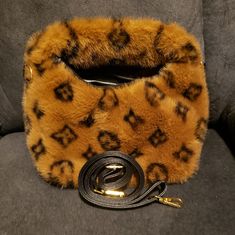 Small Brown And Black Handbag. Luxury Bags With Faux Fur Trim For Everyday Use, Brown Top Handle Satchel, Brown Top Handle Satchel As Fashion Accessory, Brown Bag With Removable Pouch, Brown Mobile Phone Shoulder Bag, Brown Bag With Adjustable Strap, Brown Crossbody Shoulder Bag, Black Bag With Dust Bag Included For Fall, Brown Clutch Bag With Detachable Strap