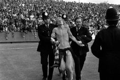 a man is being carried off the field by police