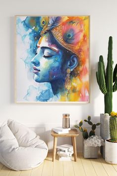 a painting hanging on the wall next to a potted cactus