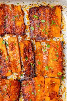 an overhead view of some food on a baking sheet with parmesan sprinkles