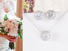 the bride's bouquet and jewelry are displayed in front of her wedding day gown