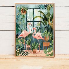 two flamingos standing in front of a window surrounded by tropical plants