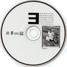 a cd with an image of a tennis player on the disc, in black and white