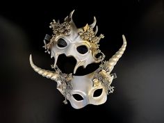 Stunning couples mythical horned masquerade mask set in white gold, perfect for masquerade parties, balls, Halloween, and more! C U S T O M I Z A T I O N Can be customized further. Get in touch for custom orders! S I Z E  Adult size. S H I P P I N G -  Processed same day or within 24 hours.  1-2 day guaranteed delivery, add item to cart, click shipping tab for rates.  Pls leave a check out note with your need date & contact number  Msg for delivery time frames (Include your state/country) C O N Gold Masquerade Mask For Carnival Cosplay, Fantasy Horned Masquerade Mask For Costume, Fantasy Horned Masks For Masquerade, White Masks For Halloween Fantasy Events, White Fantasy Masks For Halloween, Fantasy Horned Masks And Prosthetics For Party, White Fantasy Masks And Prosthetics For Costume Party, White Fantasy Eye Mask, Fantasy White Masks And Prosthetics For Costume Party