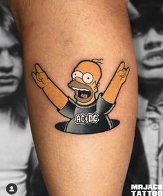 the simpsons tattoo is on someone's leg and it looks like he has his hands up