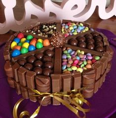 there is a chocolate cake decorated with candies