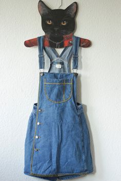 Upcycled Vintage Blue Bronze Denim Dungarees Skorts Size S, see below for measurements Brand: Dixie Blues, Authentic Original 100% cotton side button placket with breast pocket looks like a dungaree dress at first glance there are shorts under the skirt this vintage piece was painted with shimmering gold textile paint now a real eye-catcher and absolutely unique piece Vintage condition: VERY GOOD, only a small material defect on the back Waist size: approx. 33cm Length: approx. 82 cm (but can be High-waist Blue Denim Dress, High Waist Blue Shortalls With Pockets, Vintage Denim Blue Denim Dress With Pockets, Fitted Denim Blue Shortalls With Pockets, Retro Blue Denim Jumpsuit With Pockets, Blue Denim Overalls With Bib Front, Vintage Light Wash Denim Overalls, Blue Denim Overalls With Button Closure, Blue Fitted Vintage Denim Jumpsuit