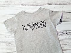 a baby t - shirt with the word iwdnado printed in black on it