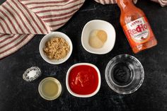 the ingredients to make an apple cider pie laid out on a black counter top