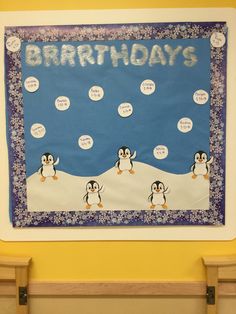 a birthday bulletin board with penguins on it