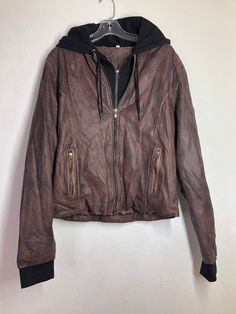 "Brown men's jacket, made from real leather, genuine and soft leather, streetstyle jacket, heavy jacket, hooded jacket, bomber jacket, vintage style, old jacket, retro style, has size - medium. Men's jacket; made from real leather; leather is genuine and soft; middle length comfortable jacket - brown color. Jacket has a straight form; jacket zipped; has two parts (layer): under leather front has textile; textile with zipper; textile part can be unfastened; jacket has two outside pocket's, with z Brown Hooded Biker Jacket With Pockets, Casual Distressed Brown Leather Jacket For Winter, Distressed Brown Outerwear For Fall Streetwear, Urban Hooded Leather Jacket For Streetwear, Leather Hooded Jacket With Pockets For Streetwear, Casual Brown Hooded Biker Jacket, Brown Hooded Leather Jacket With Detachable Hood, Brown Leather Jacket With Detachable Hood, Long Sleeve Leather Jacket With Double-lined Hood For Streetwear