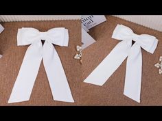 two white bows are sitting on the floor